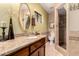 Bathroom with granite countertop, walk-in shower and tile accents at 2232 E Inglewood St, Mesa, AZ 85213