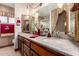 Elegant bathroom featuring a double vanity, framed mirrors, pendant lights, and stylish accents at 2232 E Inglewood St, Mesa, AZ 85213