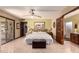 Bedroom with tiled floors and access to an outdoor patio at 2232 E Inglewood St, Mesa, AZ 85213