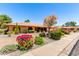 Inviting home with lush, colorful landscaping and mature trees at 2232 E Inglewood St, Mesa, AZ 85213