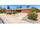 Beautiful single-story home with desert landscaping and a spacious driveway at 2232 E Inglewood St, Mesa, AZ 85213