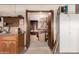 Organized garage space with doorway to workshop area, cabinets, and ample room for parking at 2232 E Inglewood St, Mesa, AZ 85213