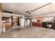 Large garage with abundant cabinet and wall storage, utility sink, and an attached workshop area at 2232 E Inglewood St, Mesa, AZ 85213