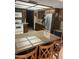 Kitchen featuring granite countertops, stainless steel appliances, and dark wood cabinets at 2232 E Inglewood St, Mesa, AZ 85213