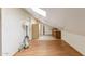 Attic features wood laminate flooring, closet, and skylight at 2455 E Broadway Rd # 68, Mesa, AZ 85204