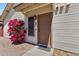 Inviting front entrance with desert landscaping and vibrant pink bougainvillea, creating curb appeal at 2455 E Broadway Rd # 68, Mesa, AZ 85204