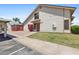 Charming townhome exterior with desert landscaping, private front door, and covered parking area at 2455 E Broadway Rd # 68, Mesa, AZ 85204