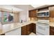 Efficient kitchen with essential appliances and great natural light, for culinary creativity at 2455 E Broadway Rd # 68, Mesa, AZ 85204