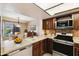 Updated kitchen featuring stainless steel appliances, ample counter space, and natural lighting at 2455 E Broadway Rd # 68, Mesa, AZ 85204