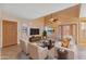 Bright living room featuring high ceilings, neutral decor, plantation shutters, and french doors at 2455 E Broadway Rd # 68, Mesa, AZ 85204