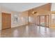 A spacious living room with tile flooring, featuring high ceilings and natural light at 2455 E Broadway Rd # 68, Mesa, AZ 85204