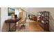 Bright home office with built-in shelving, warm neutral paint, and hardwood flooring at 2455 E Broadway Rd # 68, Mesa, AZ 85204