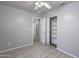 Comfortable bedroom with tiled floors and an attached closet at 24709 N 75Th Way, Scottsdale, AZ 85255