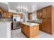 Modern kitchen featuring granite countertops, stainless appliances, a kitchen island, and ample storage at 24709 N 75Th Way, Scottsdale, AZ 85255