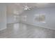 Spacious living room with tile flooring, natural light, and ceiling fans at 24709 N 75Th Way, Scottsdale, AZ 85255