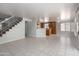 Spacious living area with stairs, neutral walls, tile flooring, and an open layout ideal for entertaining at 24709 N 75Th Way, Scottsdale, AZ 85255
