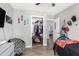 Bedroom featuring closet, natural light, neutral tones, and access to other rooms at 25615 S Lemon Ave, Queen Creek, AZ 85142