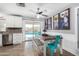 Cozy kitchen features stainless steel appliances and a charming dining area with pool views at 25615 S Lemon Ave, Queen Creek, AZ 85142