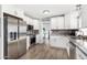 Updated kitchen featuring stainless steel appliances, granite counters, and ample cabinet space at 25615 S Lemon Ave, Queen Creek, AZ 85142