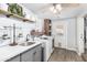 Bright laundry room with gray cabinets, quartz countertops, and modern washer and dryer at 25615 S Lemon Ave, Queen Creek, AZ 85142