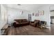 Comfortable living room with neutral walls, wood-look floors, stylish décor, and ample space for entertaining at 25615 S Lemon Ave, Queen Creek, AZ 85142