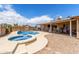 Backyard pool and covered patio ideal for entertaining guests at 25615 S Lemon Ave, Queen Creek, AZ 85142