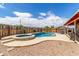 Backyard pool and spa feature blue tile and concrete surround at 25615 S Lemon Ave, Queen Creek, AZ 85142