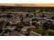 Expansive aerial view showcases a residential neighborhood with well-maintained homes, landscaping, and desert views at 2565 N 141St Ln, Goodyear, AZ 85395