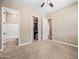 Spacious bedroom with en-suite bathroom and walk-in closet, designed for comfort and convenience at 2565 N 141St Ln, Goodyear, AZ 85395