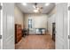 Bedroom featuring neutral-toned walls, a ceiling fan, a window, and closet with mirrored doors at 2565 N 141St Ln, Goodyear, AZ 85395