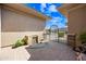 Charming courtyard entrance with a water feature and wrought iron gate at 2565 N 141St Ln, Goodyear, AZ 85395