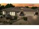 Beautiful single-story home features stone accents, desert landscaping, private courtyard, and three-car garage at 2565 N 141St Ln, Goodyear, AZ 85395