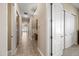 Inviting hallway with ceramic tile flooring leads to various rooms in the home at 2565 N 141St Ln, Goodyear, AZ 85395