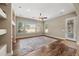 Bright living room with ceiling fan, wood floors, and an abundance of natural light at 2565 N 141St Ln, Goodyear, AZ 85395