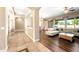 Open floorplan featuring hardwood flooring, recessed lighting, and arched entryways at 2565 N 141St Ln, Goodyear, AZ 85395