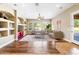 Bright living room with hardwood floors, built-in shelving, and comfortable seating at 2565 N 141St Ln, Goodyear, AZ 85395