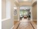 Open-concept living room boasts tile floors, recessed lighting, and views of the lush backyard at 2565 N 141St Ln, Goodyear, AZ 85395