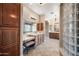 Main bathroom features dual sinks, a makeup vanity, and a linen closet at 2565 N 141St Ln, Goodyear, AZ 85395