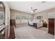Bright, carpeted main bedroom with plantation shutters and generous closet space at 2565 N 141St Ln, Goodyear, AZ 85395