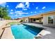 Gorgeous swimming pool and landscape creating a backyard oasis for relaxing and entertaining at 2565 N 141St Ln, Goodyear, AZ 85395