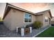 A well landscaped backyard featuring a small water fountain, bench, and decorative gravel at 2727 N Acacia Way, Buckeye, AZ 85396