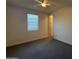 Comfortable bedroom with a ceiling fan and window, creating a calming atmosphere at 2727 N Acacia Way, Buckeye, AZ 85396
