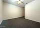 Simple bedroom with neutral carpet and a ceiling fan at 2727 N Acacia Way, Buckeye, AZ 85396