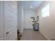 Entryway with tile flooring, white walls, and decorative hooks, creating a welcoming space at 2727 N Acacia Way, Buckeye, AZ 85396
