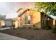 Charming home showcasing stucco siding, stone accents, and well-manicured landscaping at 2727 N Acacia Way, Buckeye, AZ 85396