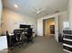 Office area with a desk, chairs, and a storage unit, providing a functional workspace at 2727 N Acacia Way, Buckeye, AZ 85396
