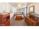 Bedroom featuring a bed with blue accents, dark wooden furniture, and southwestern decor at 3104 E Broadway Rd # 212, Mesa, AZ 85204