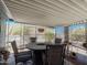 Covered patio featuring a round table with chairs and desert landscaping views at 3104 E Broadway Rd # 212, Mesa, AZ 85204