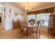 Bright dining area with a glass table, wood chairs, and natural lighting at 3104 E Broadway Rd # 212, Mesa, AZ 85204