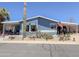 Attractive single-story home featuring low-maintenance desert landscaping and a covered porch at 3104 E Broadway Rd # 212, Mesa, AZ 85204